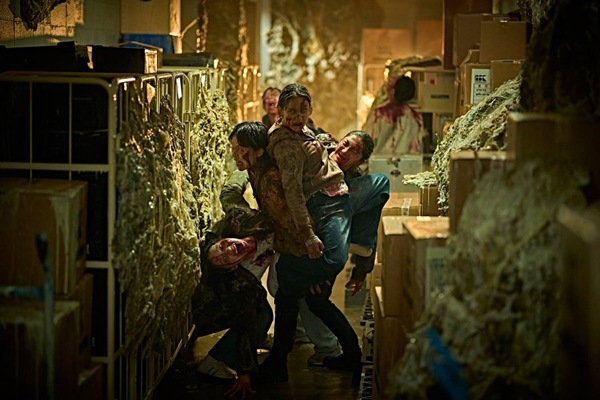 The terrifying ant-inspired hive mind zombie horde chasing survivors inside a locked-down biotech building in Colony.