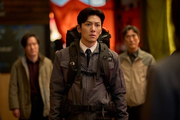 Actor Ji Chang-wook as a security guard fighting through a skyscraper maze in the zombie epic Colony